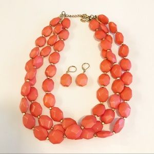 Coral colored necklace and earrings